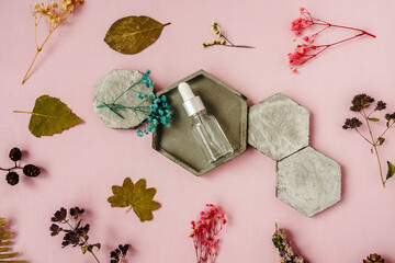 Top view of face serum on concrete.