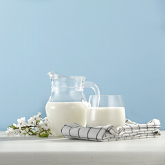 Fresh milk on desk and blue background 