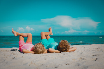 Fototapeta na wymiar happy boy nd girl relax on tropical beach