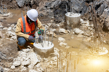 Technicians use special tools to check the integrity of the pile.