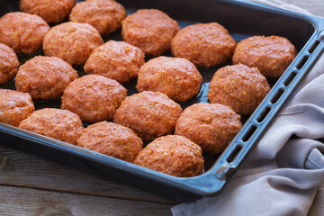 Raw beef and pork meat cutlets, cooking at home