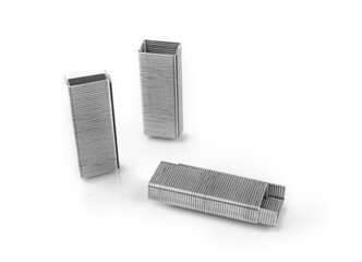 Stapler staples in form of buildings isolated on a white background, concept for stationery
