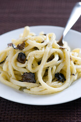 Strangozzi or Stringozzi is a typical handmade pasta made in the Umbria region in Italy