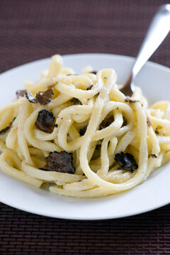 Strangozzi or Stringozzi is a typical handmade pasta made in the Umbria region in Italy