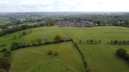 Obraz premium Aerial view of some housing on the edge of some open countryside