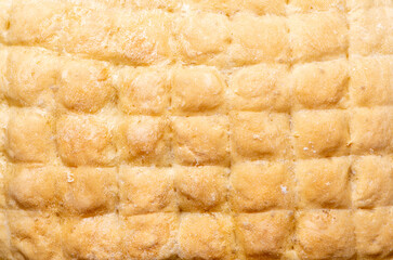Full frame of the top crust of a freshly baked wheat cake.