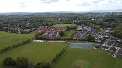Fototapeta na wymiar Aerial view of playing fields, trees and new housing development