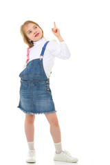 Little girl is showing a finger.The concept of advertising goods and services.