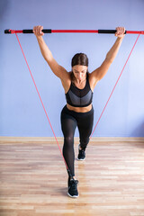 Naklejka premium woman goes in for sports in the gym. Sports. Healthy lifestyle.