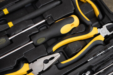 A set of black and yellow tools