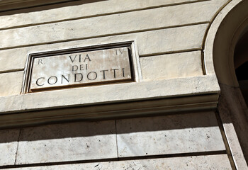 text VIA CONDOTTI  on the historic building of the famous street of the historic center of the city of Rome where there are exclusive luxury shops