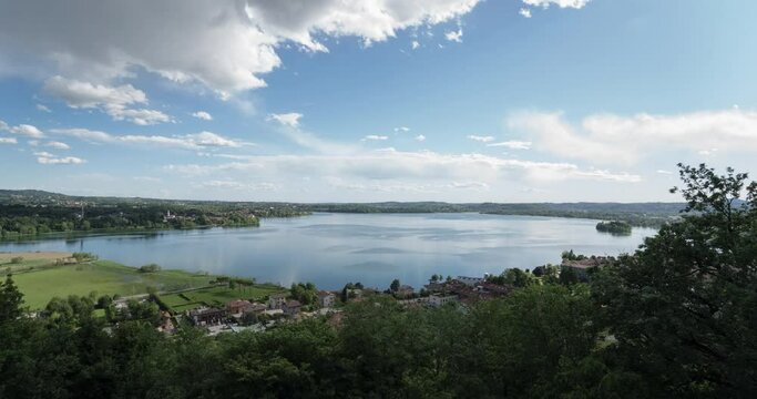 Lake of Pusiano ultra wide angle view panoramic time lapse of a sunset landscape. 