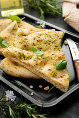 Pita bread slices. Focaccia bread with rosemary, olive oil.