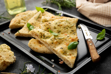 Pita bread slices. Focaccia bread with rosemary, olive oil.