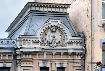 Coat of arms on the facade of the old building in Kyiv Ukraine