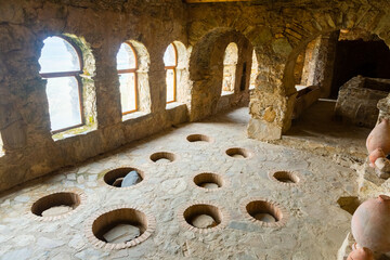 Interior of ancient wine cellar in bishop palace on territory of Georgian Orthodox Nekresi...