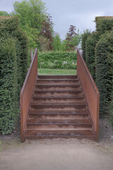 Iron rusty stairs in the park in rain