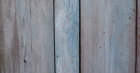 Old wooden surface with blue peeling paint