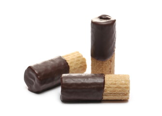 Waffle rolls partially covered with chocolate isolated on white background