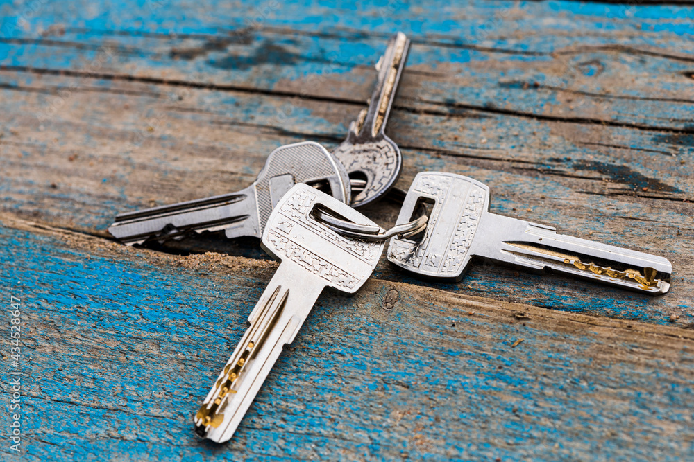 Poster Set of keys lie on a wooden surface. Forgotten keys