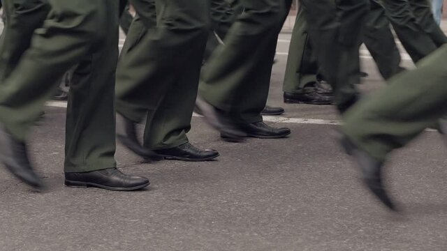 Close-up of the legs of the military, who march on the parade