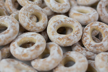 white bagels in powdered sugar background baking