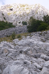 Marble debris on the mountains of the Apuan Alps in Tuscany.The Apuan mountains between the Foce di Giovo and the Passo delle Pecore in Orto di Donna. Apuan Alps, Tuscany, Italy. 