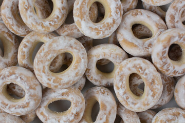 white bagels in powdered sugar background baking