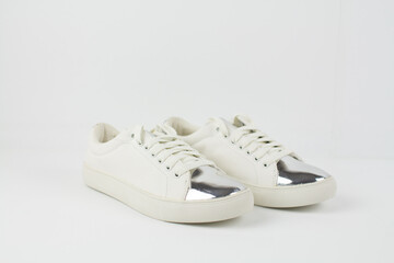white leather sneakers on a white background
