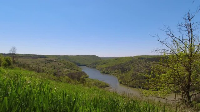 Slow-motion view from above on the Ternava river and canyon of national nature park Podilski Tovtry