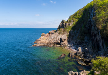 Rocky beach and beautiful natural surroundings summer time at Kullaberg nature reserve on the Swedish West Coast.