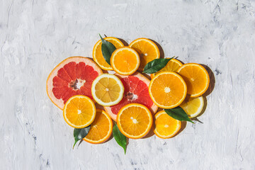 Citrus fruits. Orange, lemon, grapefruit,  on a trendy stone background  Top view, flat lay