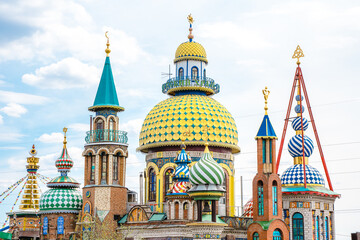 Fototapeta na wymiar Colorful temple of all Religions in Kazan against the blue sky, Russia