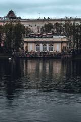 Fototapeta na wymiar An old house with a summer veranda on the patriarch's ponds in the center of Moscow. Vertical