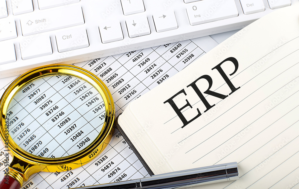 Poster erp text on notebook with chart, magnifier,keyboard and pen