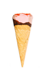 
Ice cream cone close up. Pink ice cream scoop in a waffle cone on an isolated white background. Strawberry or raspberry flavor sweet dessert decorated with chocolate and colorful sprinkles, close up