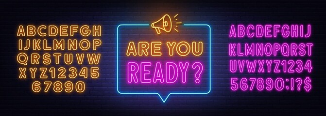 Are You Ready neon sign in the speech bubble on brick wall background.