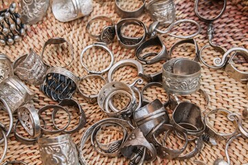 Silver rings on wicker basket background