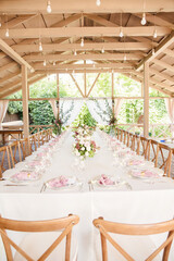 wedding decorations. Table decoration with flowers and candles, holiday catering in rustic style