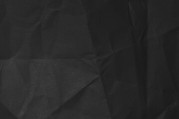 Dark background from the texture of crumpled paper