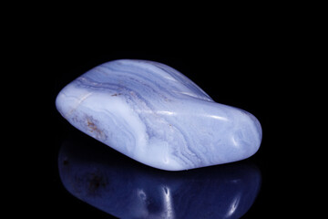 Macro mineral blue agate sapphirin in the rock on black background