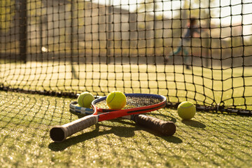 Tennis game. Tennis ball with racket on the tennis court. Sport, recreation concept.