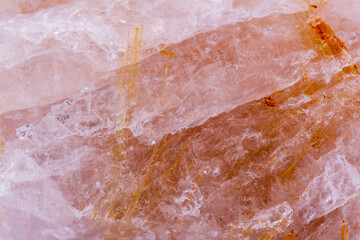 stone macro minerals rutile in quartz on a white background