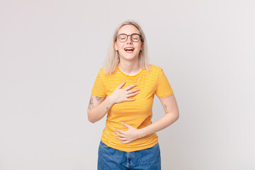 blond pretty woman laughing out loud at some hilarious joke