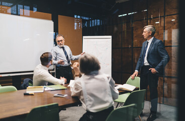 Serious managers having conference in office