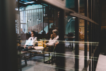 Group of colleagues working in modern office in daytime