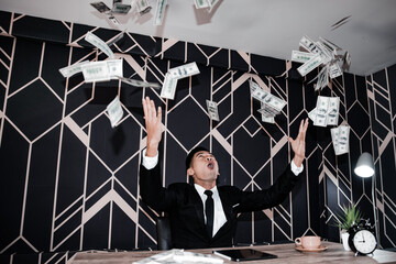 Successful businessmen celebrates success under money rain falling down dollar bills . Finances...