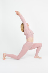 Senior Caucasian Woman Practicing Yoga Asana Pose In Professional Sport Outfit