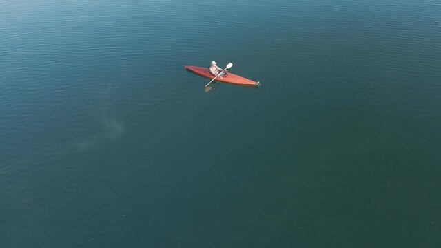 4K Drone footage of young  Indian kayaking in a misty lake in Kotagiri, Nilgiris, Chennai Tamil Nadu, India 60FPS for slow motion