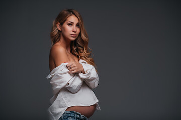 Young beautiful pregnant woman white shirt